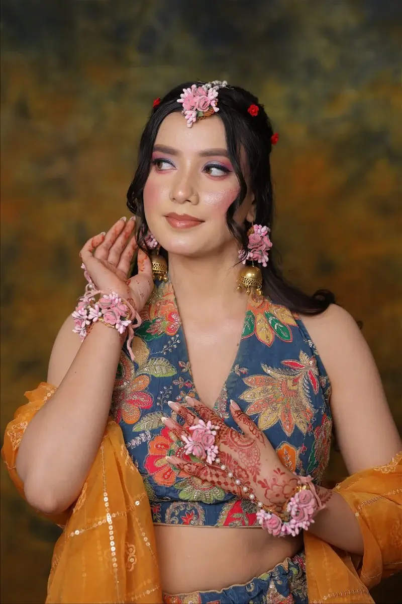 fresh Haldi and Mehendi makeup with floral jewellery and a joyful finish by Priyanshi in Roorkee