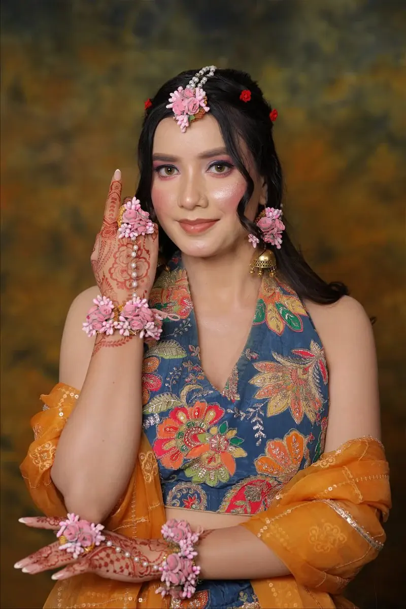 fresh Haldi and Mehendi makeup with floral jewellery and a joyful finish by Priyanshi in Roorkee