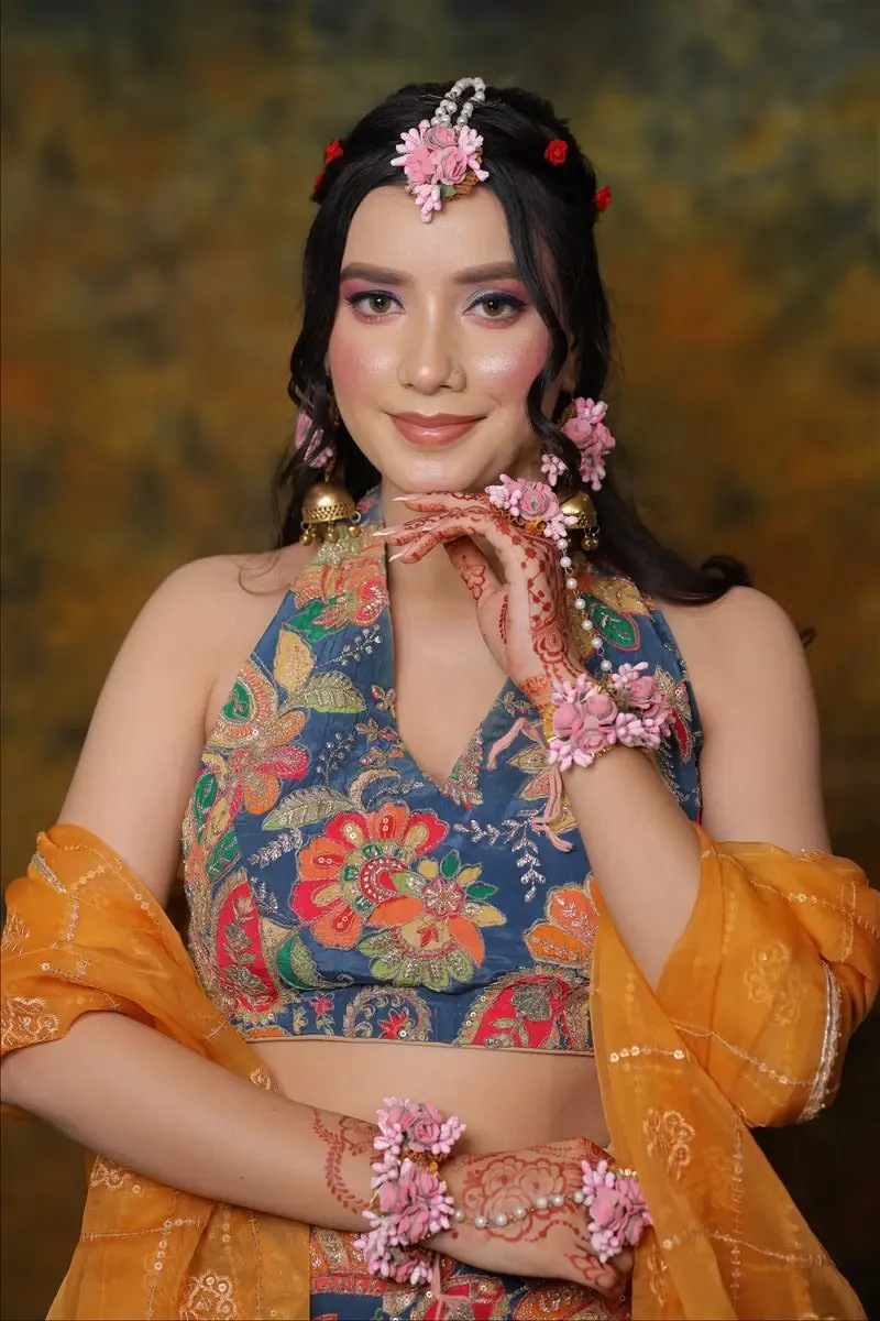 fresh Haldi and Mehendi makeup with floral jewellery and a joyful finish by Priyanshi in Roorkee